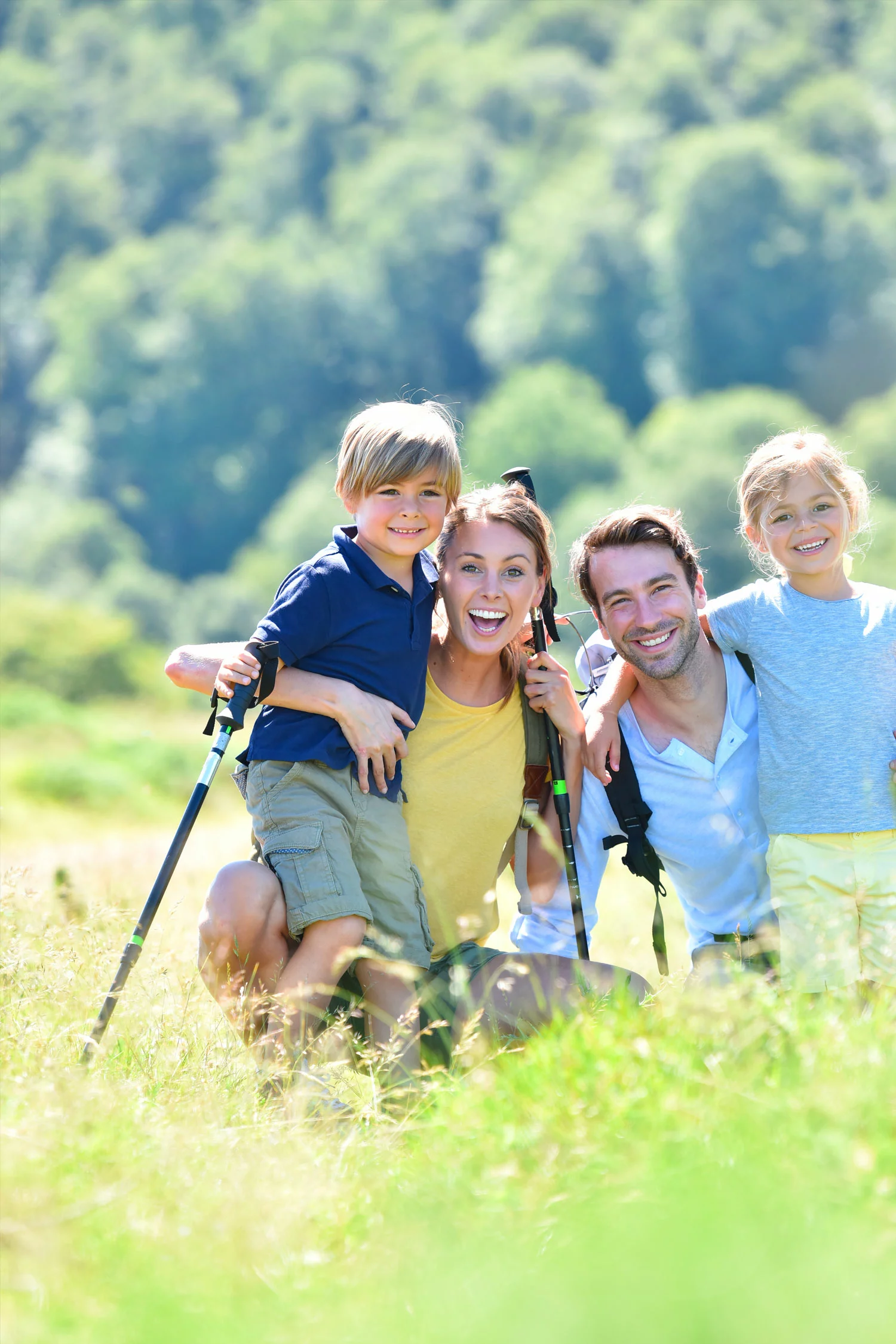 smiling family hiking in the Smoky Mountains