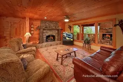 spacious living room with fireplace in a Gatlinburg rental cabin