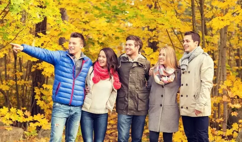 friends hanging out outside in the fall