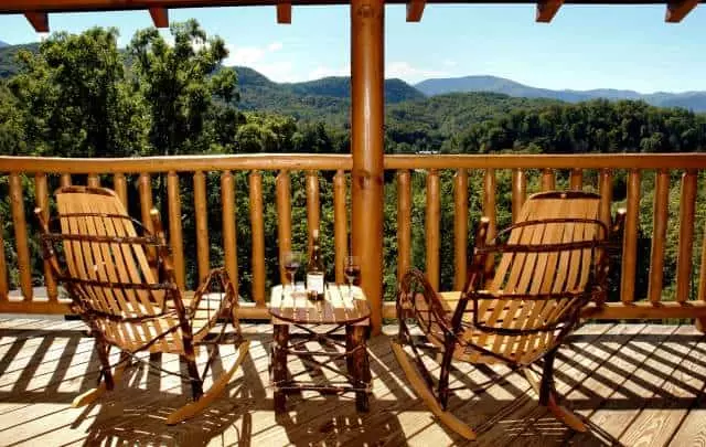 rocking chairs and table on the deck of a Gatlinburg TN vacation rental