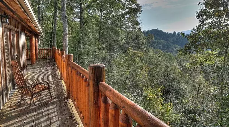 rocking chair on the deck of a Gatlinburg Tn mountain view cabin