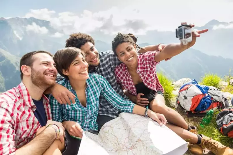 two couples taking a selfie while on a hike in the Smoky Mountains