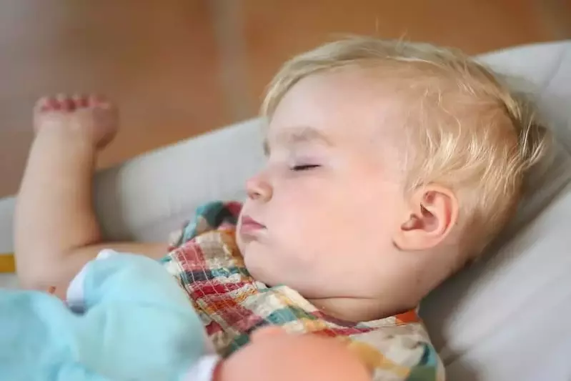 child sleeping in a Smoky Mountain log cabin