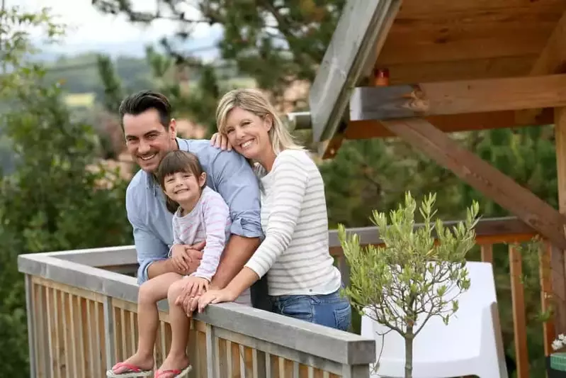 Happy family on the porch of a Gatlinburg cabin