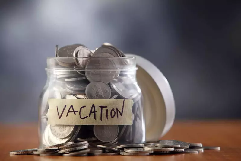 coins in a jar labeled vacation