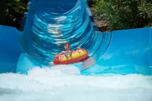 person in tube on waterslide
