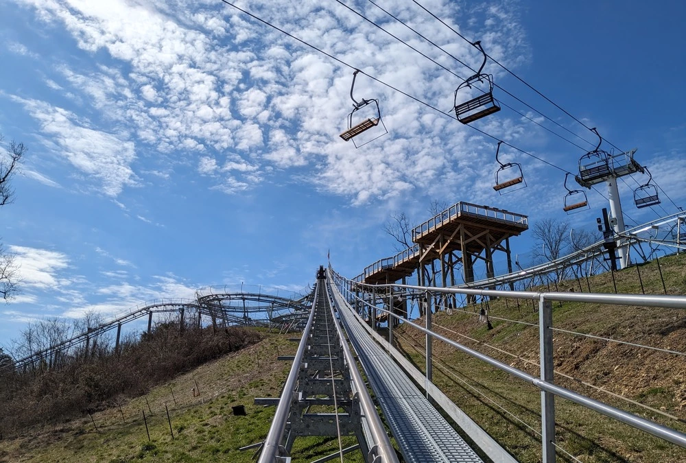 Riding The Wild Stallion Mountain Coaster under chairlift at SkyLand Ranch