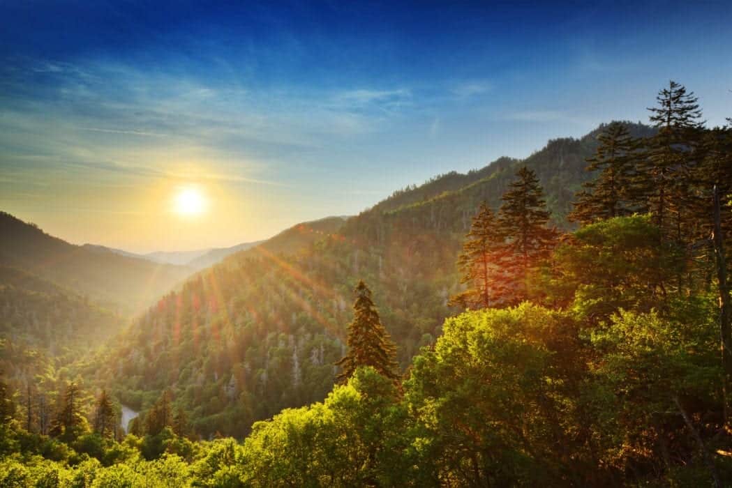 sun rays shining over a valley in the Smoky Mountains
