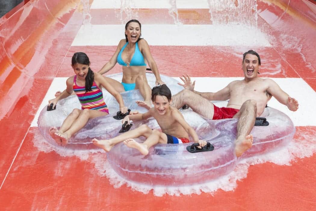 Family tubing down a water slide at Dolly's Splash Country