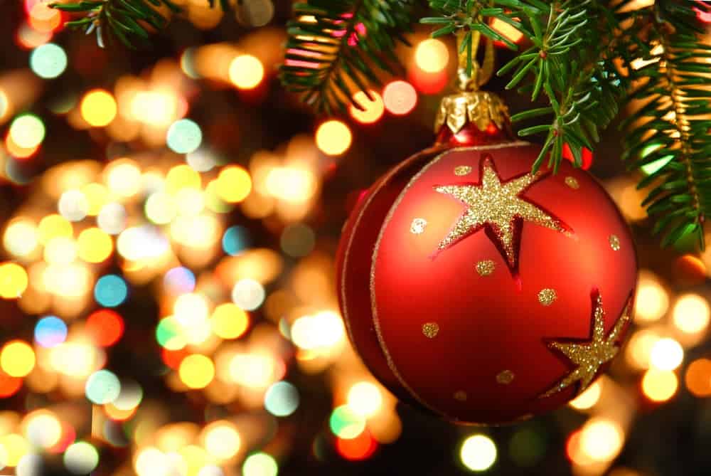Christmas ornament on a lit Christmas tree