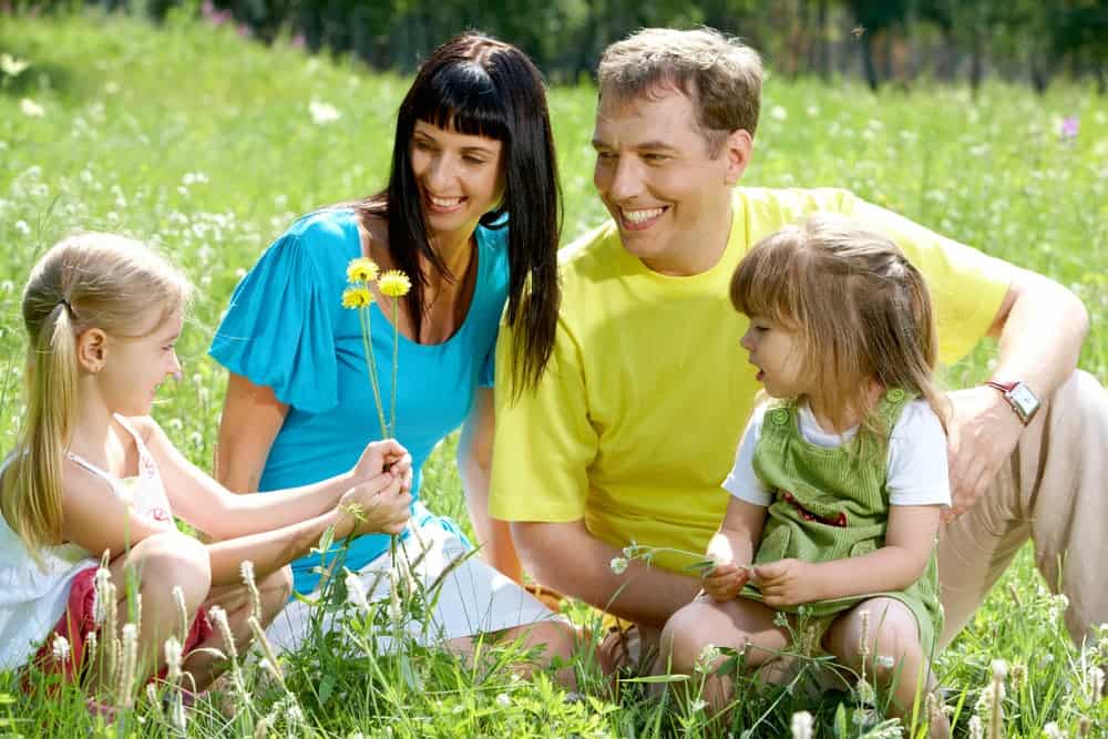 Family enjoying spring flowers in a Smoky Mountain meadow