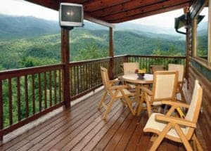 Chairs and tables on the deck of a Gatlinburg cabin.