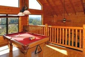 a pool table ready for play in a Gatlinburg TN cabin rental