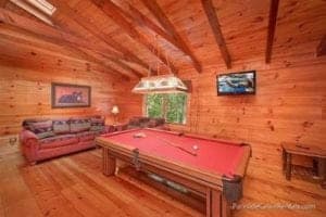 a game room with pool table in a cabin in Gatlinburg
