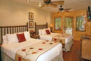 bedroom at down the creek large group cabin rental in Gatlinburg Parkside Cabins