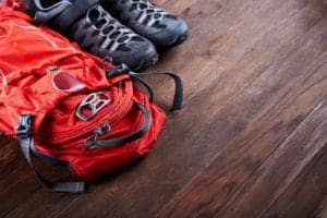 hiking boots and red backpack