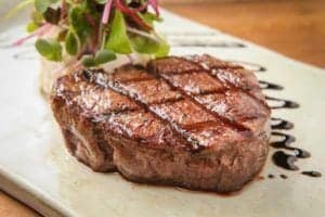 steak on plate in restaurant